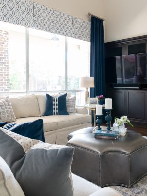 Traditional Dallas living room design with neutral palette and custom furnishings by Twilly & Fig.